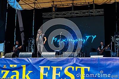 Rock band performs on a stage during outdoor free ethno-rock festival Kozak Fest Editorial Stock Photo