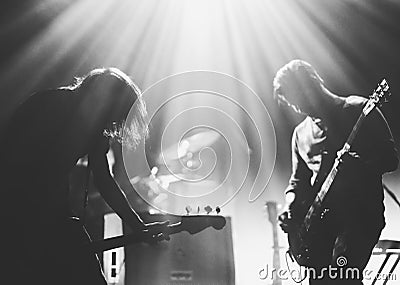 Rock band on a stage in a backlights Editorial Stock Photo