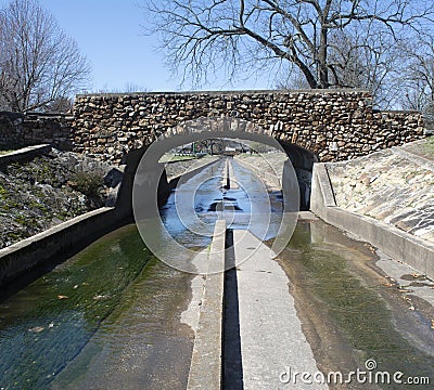 The Symmetry and Converging Lines of a Rock Bridge Stock Photo