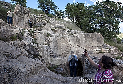 A rock carving at Arsameia in Turkey depicting King Antiochus shaking hands with Hercules. Editorial Stock Photo