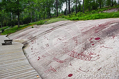 Rock Carvings from Bronze Age, which are about 3000 years old, located at one time on the shores of the fjord, now a UNESCO World Editorial Stock Photo