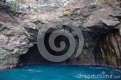 Rock cave on Vestmanna sea cliffs on Faroe Islands Stock Photo