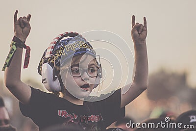 Rock child with horns up Editorial Stock Photo