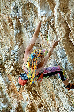Rock climber girl on challenging overhanging tufa climbing route in Kalymnos, Greece Editorial Stock Photo