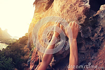 Rock climber hands climbing at seaside mountain cliff rock Stock Photo