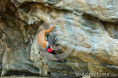 Rock Climber at Railay Beach, Krabi, Thailand. Stock Photo
