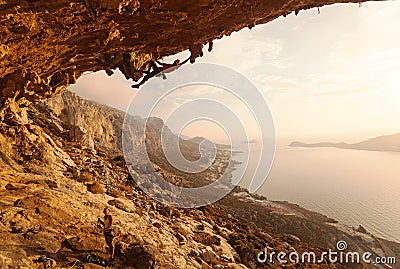Rock climber at sunset Stock Photo