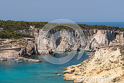 The rock and cobalt blue sea of San Domino Island on the archipelago of the tremiti islands in Puglia, Gargano, Italy Stock Photo
