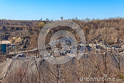 Rock crusher machine, crushing machinery, conveying crushed granite gravel stone in a granite quarry Stock Photo