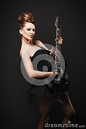 Rock female with guitar. Stock Photo