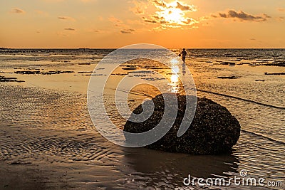 Rock and fisherman silhouette Editorial Stock Photo