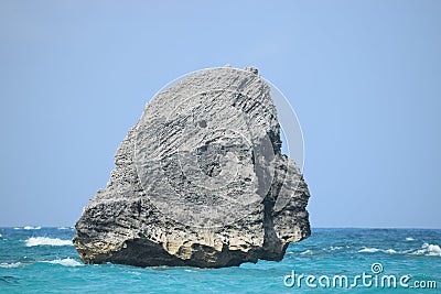Rock formation in the ocean in the shape of the Sphynx Stock Photo
