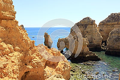 Rock formations jutting out of the Atlantic coastline of Ponta Da Piedade in Lagos Stock Photo