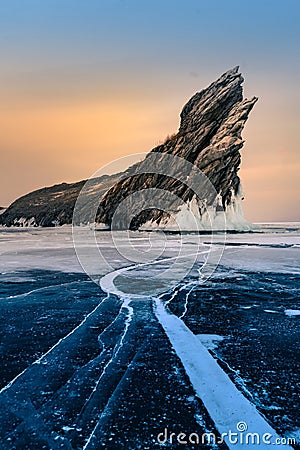 Rock on frozen winter water lake Siberian Baikal Russia Stock Photo