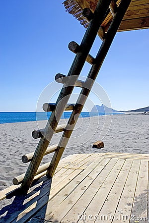 Rock of Gibraltar seen thourgh ladder on Spanish beach Stock Photo