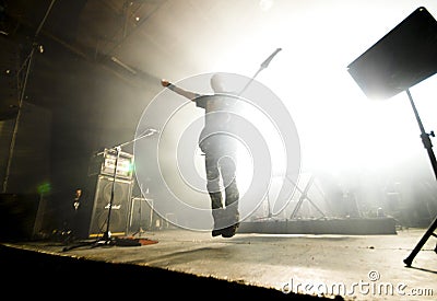 Rock guitarist in midair Stock Photo