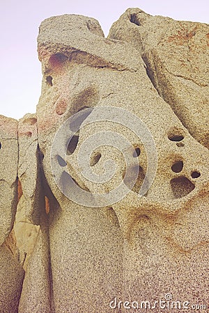Rock with holes created by the wind and water. Stock Photo