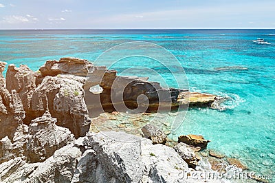Rock with holl on paradise coast Stock Photo