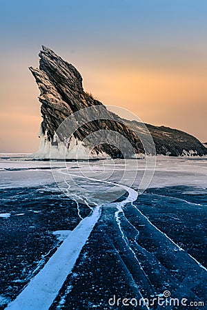 Rock mountain on freezing water lake Stock Photo