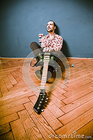 Rock musician on floor Stock Photo
