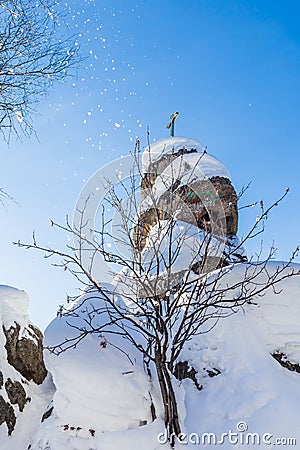 A rock with an Orthodox cross. Mountain Church. Resort Belokurikha, Altai, Russia Stock Photo