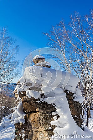 A rock with an Orthodox cross. Mountain Church. Resort Belokurikha Stock Photo