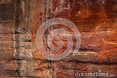 The ancient Australian Aborigines` rock painting depicting magic and sorcery in Ubirr, Kakadu National Park in Australia. Stock Photo