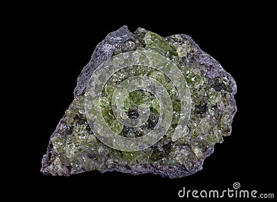 Rock with peridot olivine mineral from the USA isolated on a pure black background Stock Photo