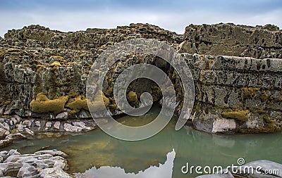 Rock pools and cliffs Stock Photo