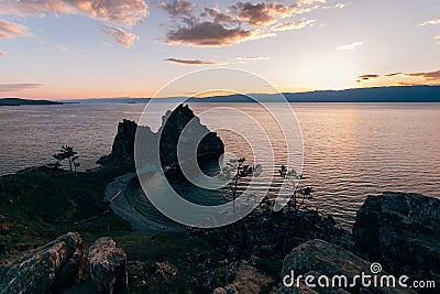 Rock shaman in the rays of the setting sun Stock Photo