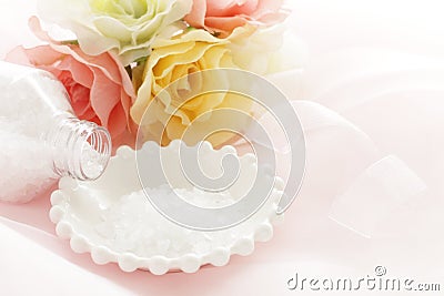 Rock slat on white plate with artificial flower Stock Photo