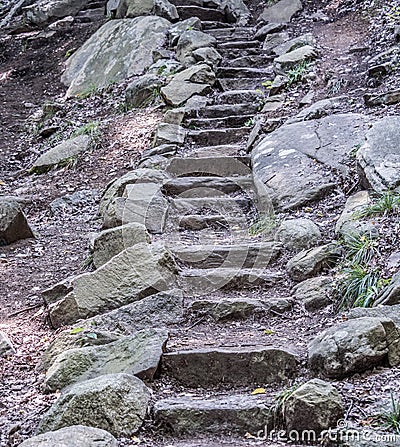 Rock stairs on the mountain trail Stock Photo