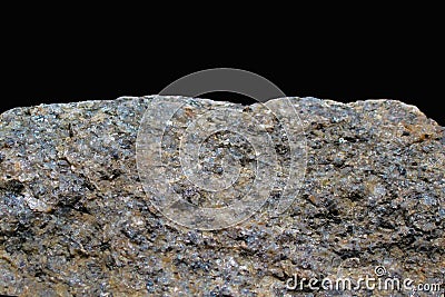 Rock or stone on black background. Granite crouan rim or pick edge like cliff or mountain. Geology mineral texture isolated closeu Stock Photo