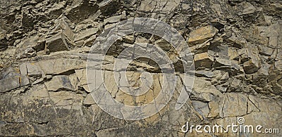 Light brown rock background. Rock texture. Detail. Mountain surface in cracks. Stock Photo