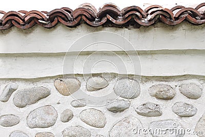 Rock wall of natural river stones. Round stones wall background. River round Stones pattern. Stones texture. River rocks. Stock Photo