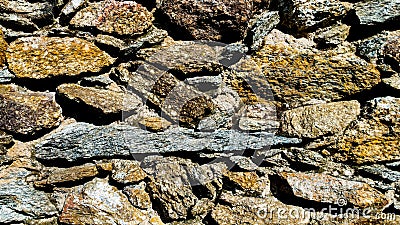 Colorful, Rock wall, part of a medieval wall, plaster joints, Light and shadow Stock Photo
