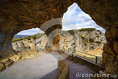 Rock windows through which you can see impressive views of the mountainous landscape. Devil's window, Stock Photo