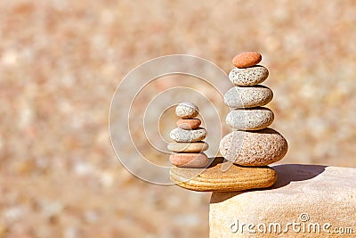 Rock zen pyramid of white, red and yellow stones. Concept of balance, harmony and meditation Stock Photo