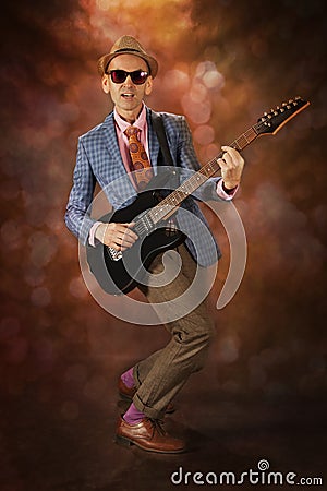 Rockabilly man playing the guitar Stock Photo