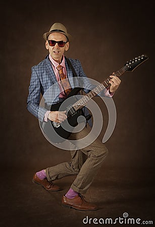 Rockabilly man playing the guitar Stock Photo