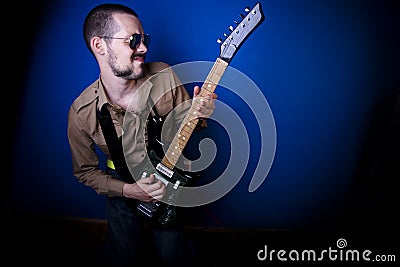 Rocker playing guitar Stock Photo