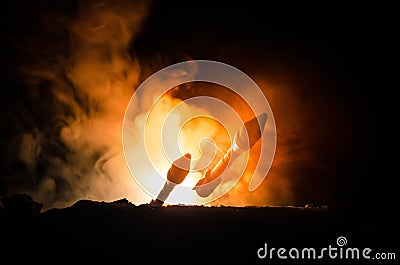 Rocket launch with fire clouds. Nuclear Missiles With Warhead Aimed at Gloomy Sky at night. Balistic Rockets War Backgound. World Stock Photo