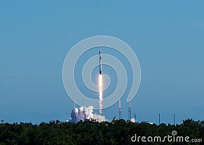 Rocket launch on a clear blue sky cloudless day Stock Photo