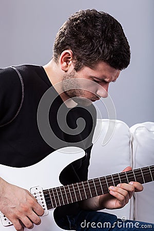 Rockman playing electric guitar Stock Photo