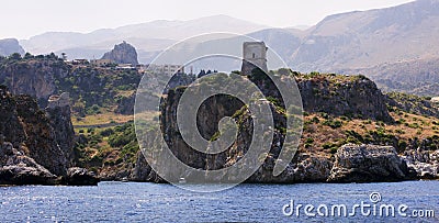 View from the sea of ancient roman tower in the Riserva dello Zingaro. Sicily. Italy. National park Zingaro Stock Photo