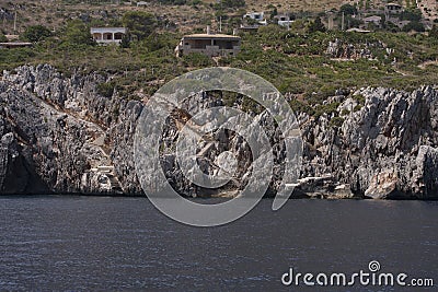 houses and stair to the sea. Riserva dello Zingaro. Sicily. Italy. National park Zingaro Stock Photo