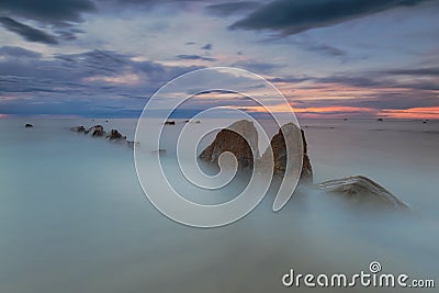 Rocks in a calm sea Stock Photo