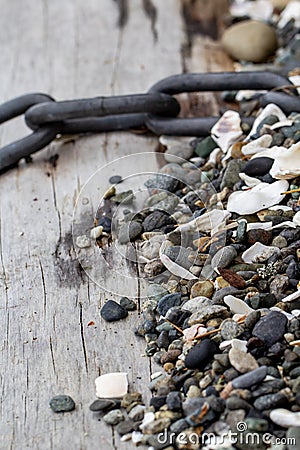Rocks and chain on a log Stock Photo