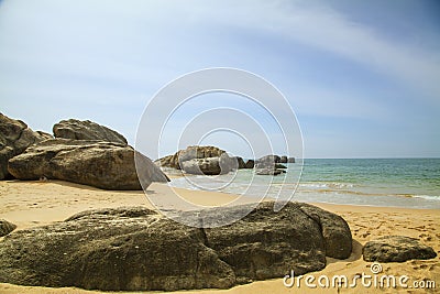 Rocks in front of the shining turquoise-blue Indian Ocean Stock Photo