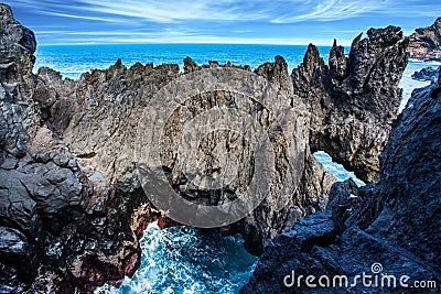 Rocks and grottoes at coast of Atlantic Stock Photo